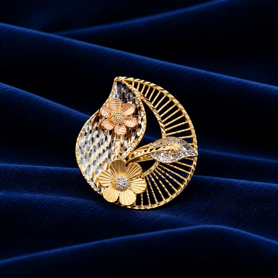 A wide gold heirloom cuff resting in a display case